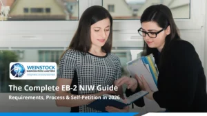 Weinstock Immigration Lawyers EB-2 NIW guide 2026 — two women reviewing documents together