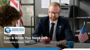 Man stamping paperwork across a desk from a client under the title Citizenship Lawyer 2026: Cost and When You Need One
