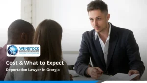 Consultation across a desk under the title Deportation Lawyer in Georgia: Cost and What to Expect